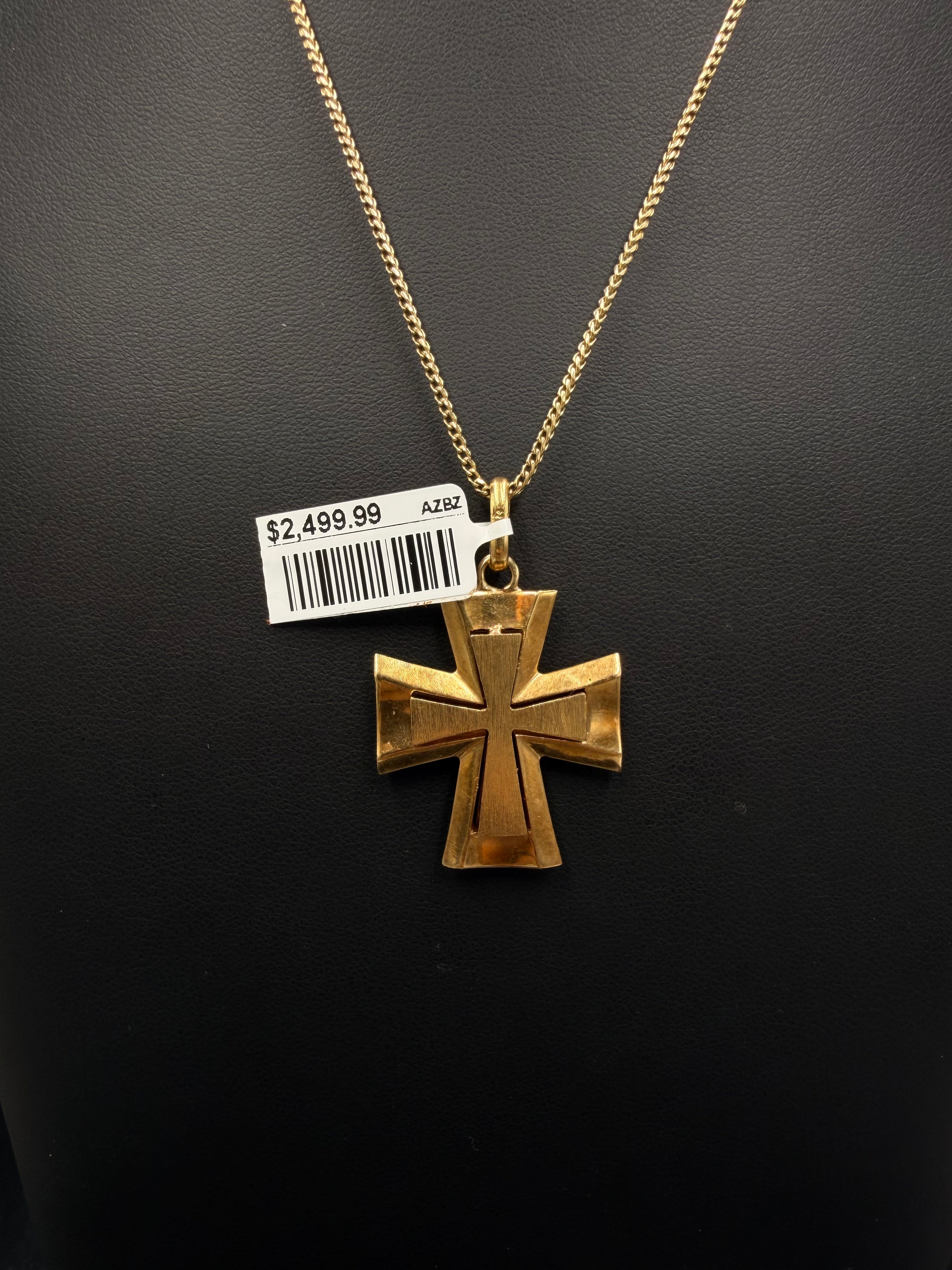 Front of 18K yellow gold flared cross pendant on a gold chain
