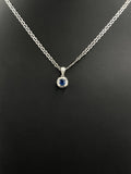 Blue Sapphire & Clear Stone Halo Pendant 2.5g — Metal Pending Verification