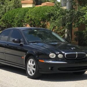 Black Jaguar parked in street